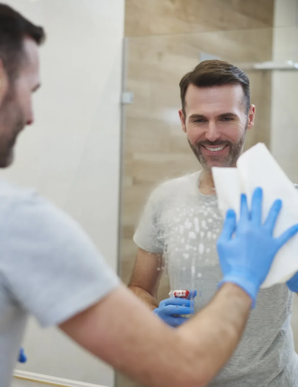 happy-man-cleaning-his-home-2024-11-27-19-06-55-utc